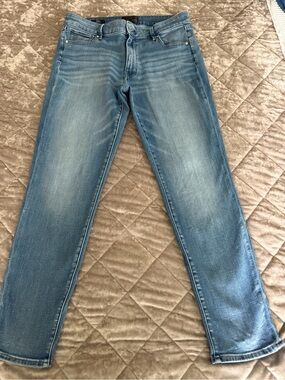 White House Black Market  light wash mid rise Slim Straight Jeans. Size 12